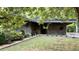 A well-maintained stone house featuring mature landscaping at 1846 Hammond St, Rocky Mount, NC 27803