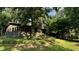 Beautiful stone house surrounded by mature trees and lush greenery, providing a sense of privacy at 1846 Hammond St, Rocky Mount, NC 27803