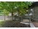 Stunning stone exterior with large windows and mature landscaping, creating a private retreat at 1846 Hammond St, Rocky Mount, NC 27803