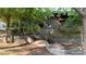 Charming stone home with multiple levels and lush greenery, offering a unique architectural design at 1846 Hammond St, Rocky Mount, NC 27803