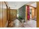 Foyer with stone accent wall, tiled floors, and modern lighting at 1846 Hammond St, Rocky Mount, NC 27803