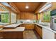 Classic kitchen featuring bright tile countertops, stainless appliances, and ample natural light at 1846 Hammond St, Rocky Mount, NC 27803