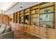 Spacious living room boasts a full wall of built-in shelving and storage with beautiful natural light at 1846 Hammond St, Rocky Mount, NC 27803