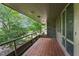 The outdoor patio has stone floors, a metal railing and green views of the yard at 1846 Hammond St, Rocky Mount, NC 27803