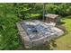 Aerial view of a large, covered swimming pool area enclosed by a fence, with a storage shed nearby at 1846 Hammond St, Rocky Mount, NC 27803