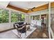 Bright and airy sunroom with large windows, wood trim, and an inviting seating area at 1846 Hammond St, Rocky Mount, NC 27803