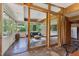 Inviting sunroom with wood trim, large windows, and an attached room, creating a relaxing space at 1846 Hammond St, Rocky Mount, NC 27803