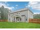 Spacious backyard features green lawn and a covered patio, perfect for outdoor entertaining at 195 Solomon Dr, Cameron, NC 28326