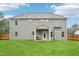 Large backyard of home, featuring a covered patio, spacious green lawn and privacy fence at 195 Solomon Dr, Cameron, NC 28326