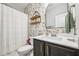 A well-decorated bathroom features floral wallpaper and modern fixtures at 195 Solomon Dr, Cameron, NC 28326