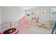 Bright ' bedroom with a playful pink tent, colorful artwork, and plush carpet for a cozy feel at 195 Solomon Dr, Cameron, NC 28326