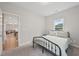 Bedroom with a metal bed frame and sunlit window at 195 Solomon Dr, Cameron, NC 28326
