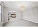 Bright and spacious bonus room featuring a modern chandelier at 195 Solomon Dr, Cameron, NC 28326