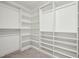 Spacious walk-in closet featuring custom shelving and ample storage for an organized wardrobe and accessories at 195 Solomon Dr, Cameron, NC 28326