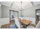Traditional dining room with coffered ceiling, wainscoting, chandelier, and wood table at 195 Solomon Dr, Cameron, NC 28326