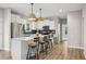 Bright, open kitchen with a large island, white cabinets, and modern pendant lighting at 195 Solomon Dr, Cameron, NC 28326