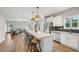 Open-concept kitchen with a large island, stainless appliances, and a view into the living area at 195 Solomon Dr, Cameron, NC 28326