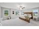 Spacious bedroom featuring a wooden headboard, ceiling fan, and sunny windows at 195 Solomon Dr, Cameron, NC 28326