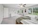 Bright bedroom boasts a wooden bedframe and ceiling fan at 195 Solomon Dr, Cameron, NC 28326