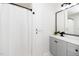 Stylish bathroom featuring a shower, modern vanity, and storage, combining functionality with contemporary design at 2001 Turtle Point Dr, Raleigh, NC 27604