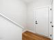 Bright entryway with hardwood floors, white walls and a white front door leading into the house at 2001 Turtle Point Dr, Raleigh, NC 27604