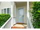Home's entryway features a white door with a storm door and well-kept front porch at 2001 Turtle Point Dr, Raleigh, NC 27604