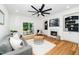 Cozy living room with hardwood floors, a fireplace, and plenty of natural light at 2001 Turtle Point Dr, Raleigh, NC 27604