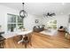Bright living room with hardwood floors, modern furnishings, and backyard access at 2001 Turtle Point Dr, Raleigh, NC 27604