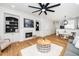Open living area featuring a fireplace, hardwood floors, and an adjacent dining area at 2001 Turtle Point Dr, Raleigh, NC 27604