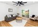 Sun-filled living room with hardwood floors, backyard views and comfortable seating at 2001 Turtle Point Dr, Raleigh, NC 27604