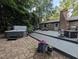 Inviting back deck featuring a hot tub, outdoor seating, and a brick house facade, perfect for relaxation at 202 Howland Ave, Cary, NC 27513