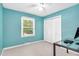 Bedroom featuring carpeted floors, blue walls, a window, a ceiling fan, a desk, and a closet at 202 Howland Ave, Cary, NC 27513