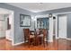 Inviting dining area with hardwood floors and a view of the modern kitchen, perfect for entertaining at 202 Howland Ave, Cary, NC 27513