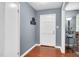 Welcoming entryway with hardwood floors and neutral paint, creating a warm and inviting atmosphere at 202 Howland Ave, Cary, NC 27513