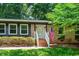 Inviting front entrance with brick steps and a white door, showcasing the home's classic charm at 202 Howland Ave, Cary, NC 27513