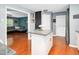 Stylish kitchen with granite countertops, hardwood floors, and an island, providing a functional layout at 202 Howland Ave, Cary, NC 27513