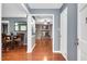 Spacious living room with hardwood floors and a cozy fireplace, perfect for Gathering gatherings at 202 Howland Ave, Cary, NC 27513