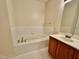 Bathroom featuring vanity and soaking tub at 211 Providence Glen, Chapel Hill, NC 27514