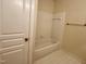 This bathroom has a shower-tub combo with white tile and a towel rack at 211 Providence Glen, Chapel Hill, NC 27514
