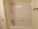 Standard white tub and shower combination with tiled walls, functional and clean at 211 Providence Glen, Chapel Hill, NC 27514