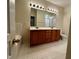 Bathroom featuring dual sink vanity, framed mirror and bath tub at 211 Providence Glen, Chapel Hill, NC 27514