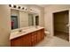 Bathroom with double vanity and walk-in closet at 211 Providence Glen, Chapel Hill, NC 27514