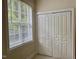 Bedroom with a bright window and a closet with folding doors at 211 Providence Glen, Chapel Hill, NC 27514