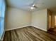 Spacious bedroom with hardwood floors and ceiling fan at 211 Providence Glen, Chapel Hill, NC 27514