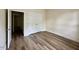 Bedroom features wood-look floors and a closet for optimal storage space at 211 Providence Glen, Chapel Hill, NC 27514