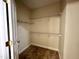 Spacious walk-in closet with carpeted floor and shelving offering plenty of storage space at 211 Providence Glen, Chapel Hill, NC 27514