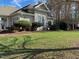 Clubhouse exterior surrounded by green lawns, bushes, and trees at 211 Providence Glen, Chapel Hill, NC 27514