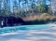 Enjoy a refreshing swim in this community pool surrounded by lush greenery and mature trees at 211 Providence Glen, Chapel Hill, NC 27514