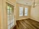 Dining room features hardwood floors and large windows for natural light at 211 Providence Glen, Chapel Hill, NC 27514