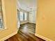 View from hallway to dining room with chandelier and large windows at 211 Providence Glen, Chapel Hill, NC 27514
